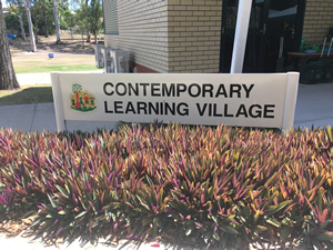 Contemporary learning village sign.